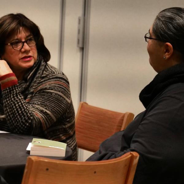 Regent Irene Greigo, left, chats with Bernadette Garcia at the summit. Photo by Casey A. Cass.