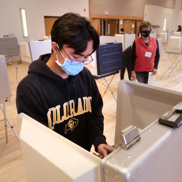 Joshua Vierra, a sophomore music cello performance major, votes at a polling place in the University Memorial Center at CU Boulder. (Photo by Casey A. Cass/University of Colorado)