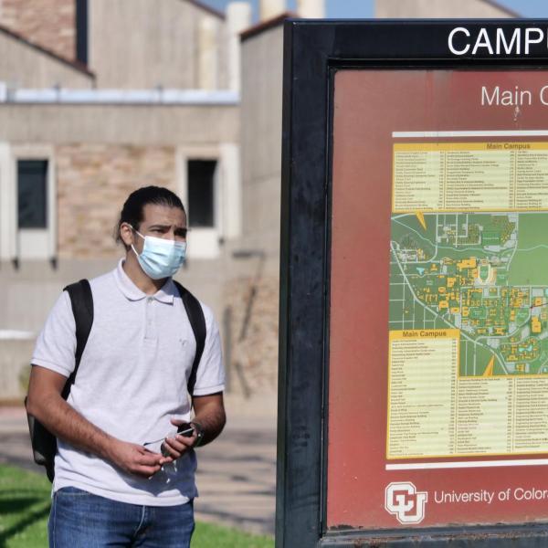 A student checks a campus map during fall 2021's first day of classes at CU Boulder. (Photo by Casey A. Cass/University of Colorado)
