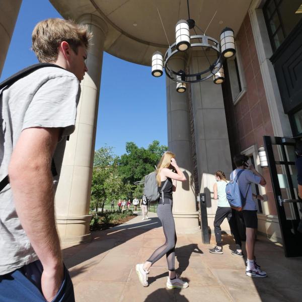 Students make their way into the Leeds School of Business during fall 2021's first day of classes at CU Boulder. (Photo by Casey A. Cass/University of Colorado)
