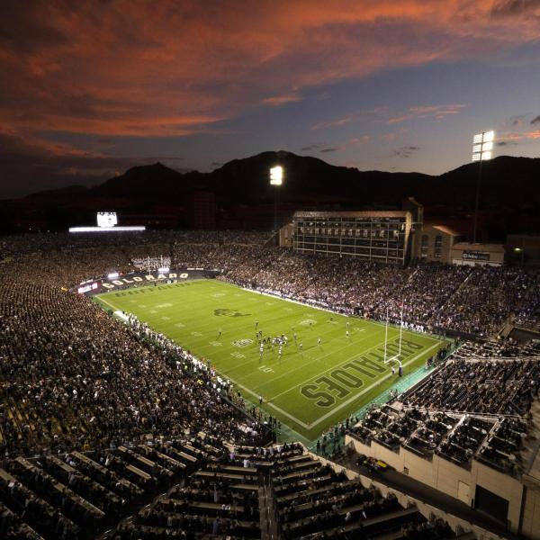 A packed Folsom Stadium at night, during the Buffs vs. TCU Horned Frogs