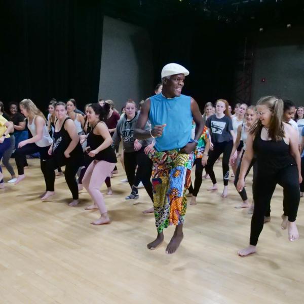 NiiAhmah Sowan leads high school students in African dance at the 2019 High School Dance Day at the CU Boulder campus. (Photo by Glenn Asakawa/University of Colorado)