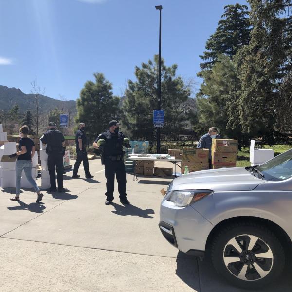 Workers unload and deliver food at a mobile food pantry on the CU Boulder campus. (Photos courtesy of CUPD and Volunteer Resource Center)