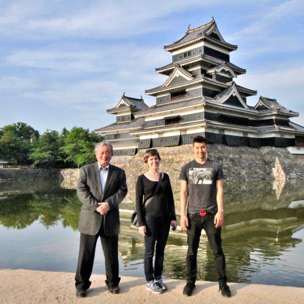 Kazunori Takato, CEO of Chiyoda Rubber Company, Danielle Rocheleau Salaz, Center for Asian Studies executive director; and Kaito Padilla, one of the first students participating in internships in Tokyo in front of Matsumoto Castle in Nagano Prefecture.