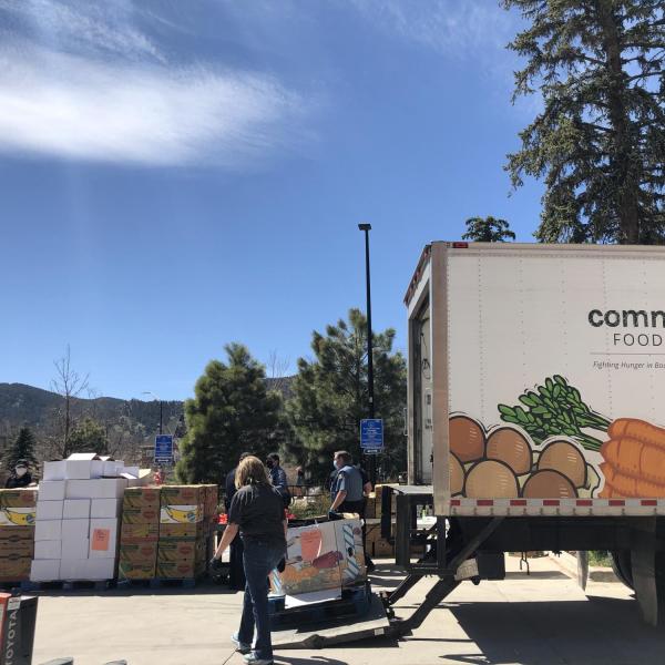 Workers unload and deliver food at a mobile food pantry on the CU Boulder campus. (Photos courtesy of CUPD and Volunteer Resource Center)