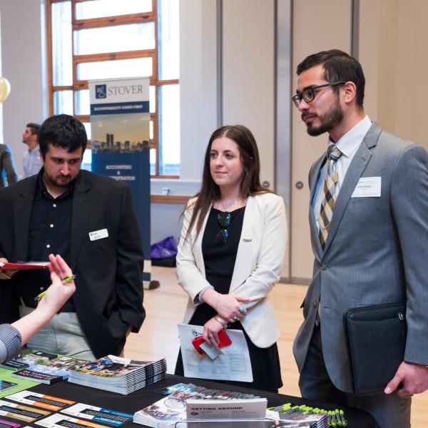 Students talk with perspective employers during the Leeds career fair. Photo by Patrick Campbell.