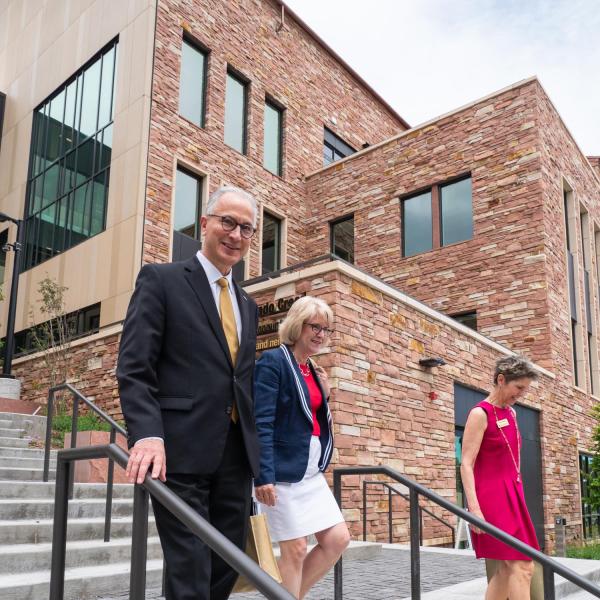 New CU President Mark Kennedy, left and his wife, Debbie, center, walk down the steps of the CASE building with Carole Capsalis, deputy chief of staff from the ChancellorÕs office, at the start of a tour of the campus. 