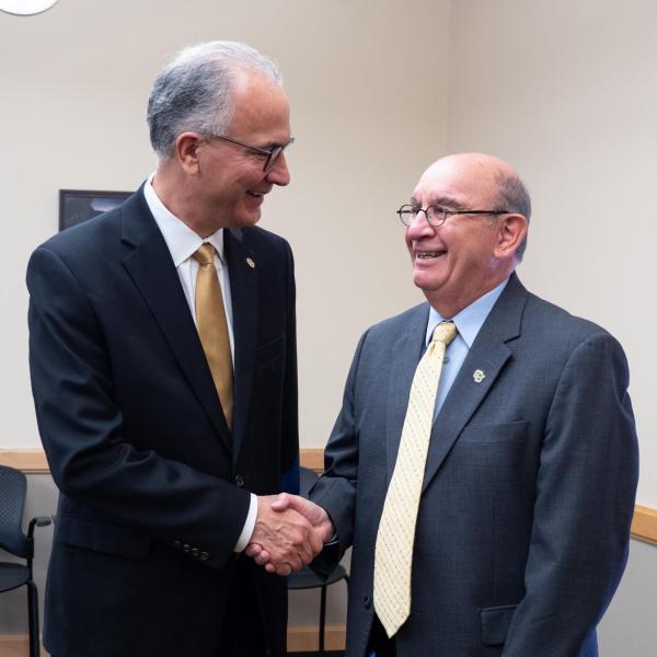 New CU President Mark Kennedy, left, greets Chancellor Phil DiStefano during his first official visit to the CU Boulder campus.