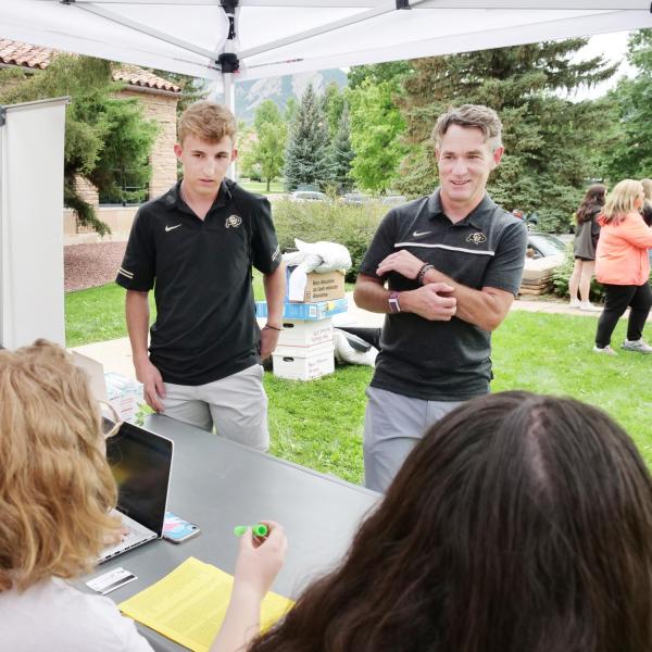 CU Boulder Chief Operating Officer Pat O’Rourke checking in his son, Ryan, during move-in