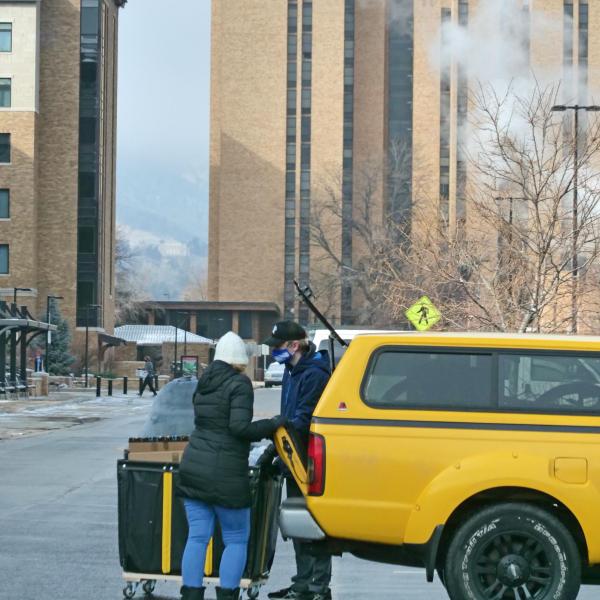 A student moves their belongings during Move-In Day on Feb. 8, 2021, at Williams Village at CU Boulder. (Photo by Casey A. Cass/University of Colorado)