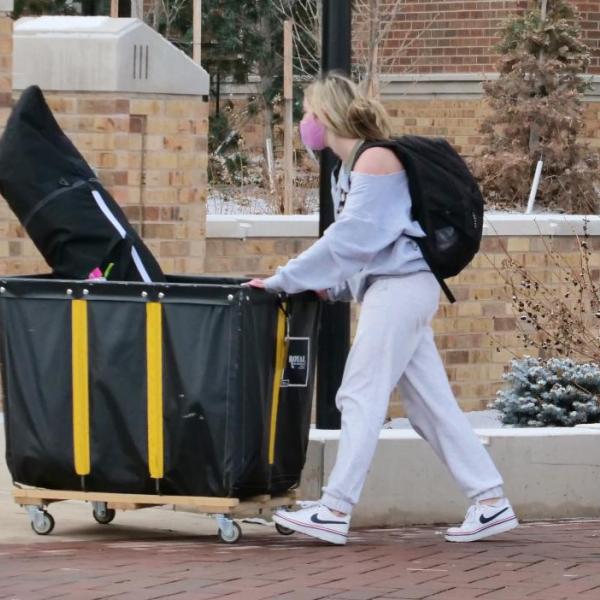 Students move their belongings during Move-In Day on Feb. 8, 2021, at Williams Village at CU Boulder. (Photo by Casey A. Cass/University of Colorado)