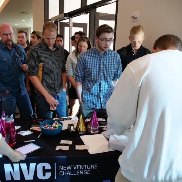 New Venture Challenge attendees line up at registration table