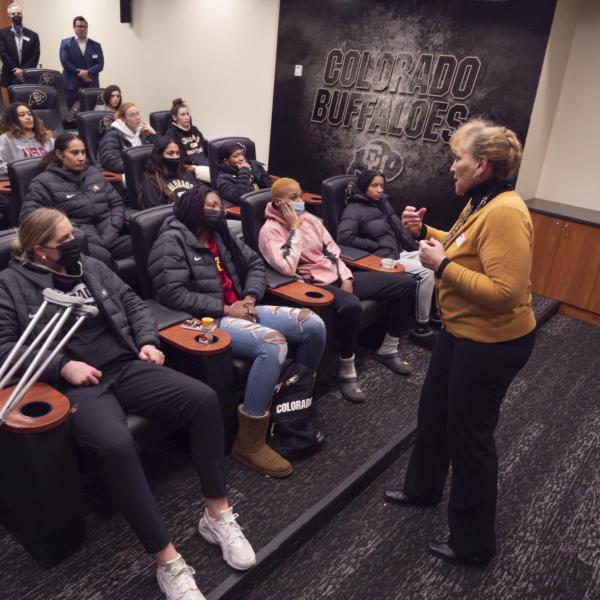 Angie Paccione speaks to members of the women’s basketball team during her visit