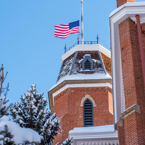 Snowy campus and a half-mast flag on Monday. Photo by Patrick Campbell.