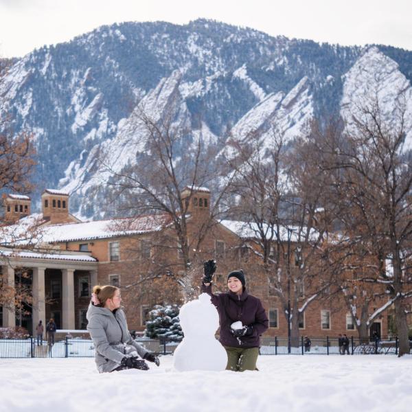 CU Boulder students play in the snow on campus Jan. 27. (Photo by Glenn Asakawa/University of Colorado)