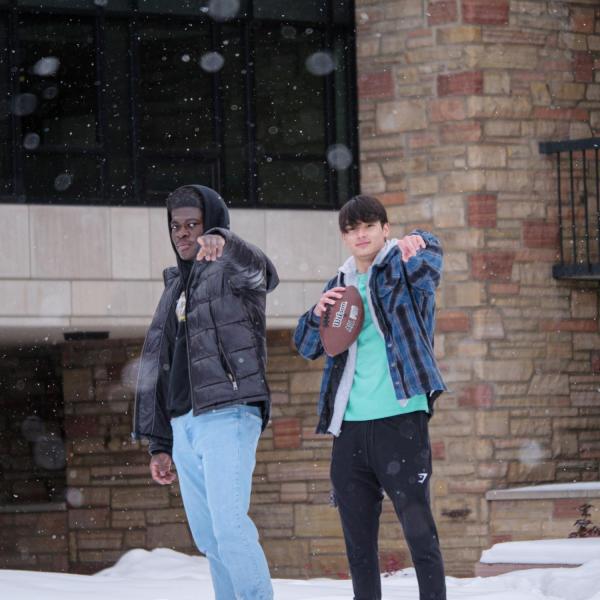 CU Boulder students play in the snow on campus Jan. 27. (Photo by Glenn Asakawa/University of Colorado)