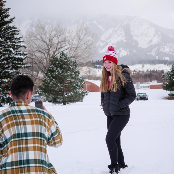 CU Boulder students play in the snow on campus Jan. 27. (Photo by Glenn Asakawa/University of Colorado)