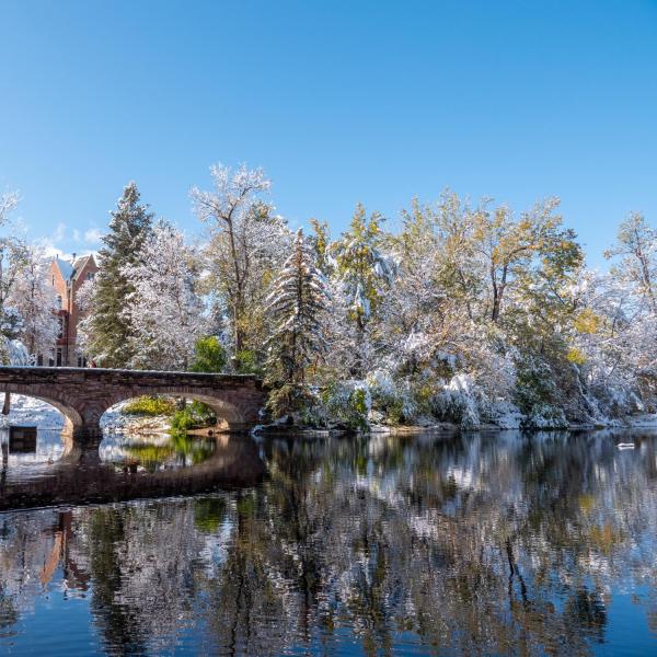 Scenic views of Varsity Lake and the bridge over it following a snow storm on Oct. 29, 2019. (Photo by Patrick Campbell/University of Colorado)