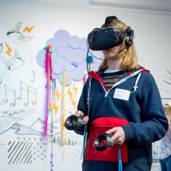 Student watches VR at the Startup Hub grand opening event. Photo by Patrick Campbell.
