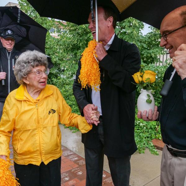 Chancellor Philip DiStefano, Athletic Director Rick George and others gathered on June 26 for a tree dedication ceremony honoring a pair of CU Buffs super fans known simply as “The Twins” -- Peggy Coppom and her late sister Betty Hoover. (Photo by Glenn Asakawa/University of Colorado)