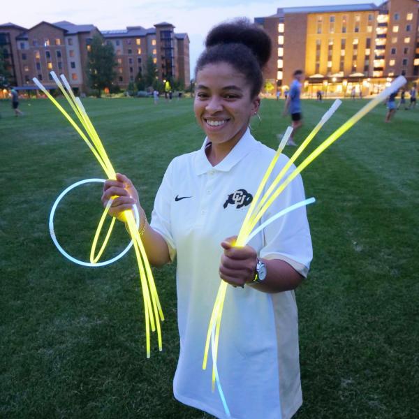 Students play glow in the dark ultimate disc at Williams Village during Move-In Week at CU Boulder. (Photo by Glenn Asakawa/University of Colorado)
