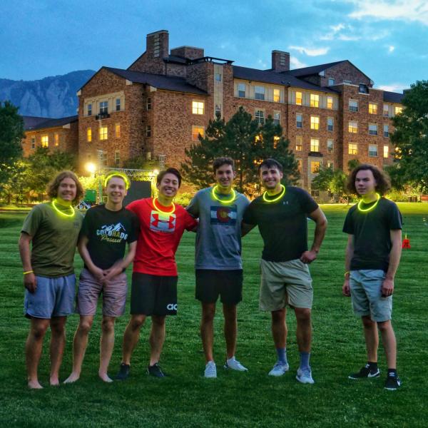 Students play glow in the dark ultimate disc at Williams Village during Move-In Week at CU Boulder. (Photo by Glenn Asakawa/University of Colorado)