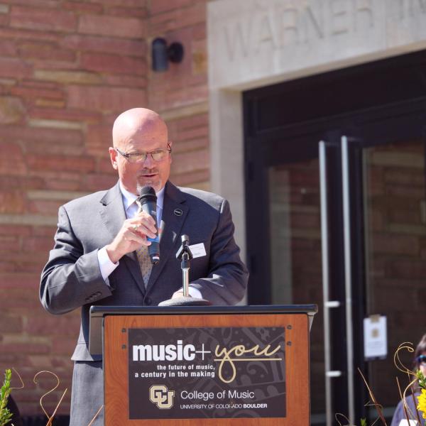 CU Boulder College of Music Dean John Davis addresses attendees of the Warner Imig Music building expansion opening ceremony. (Photo by Glenn Asakawa/University of Colorado)