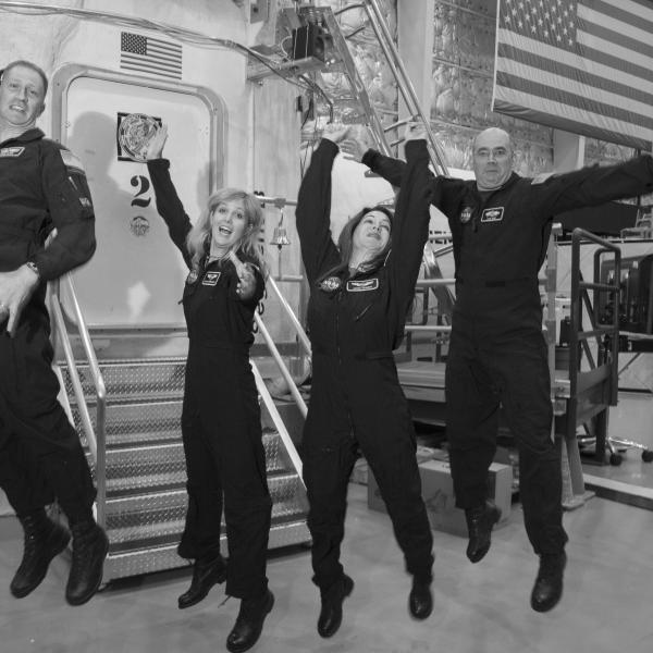 The four members of Mission XII celebrate after the mission is over