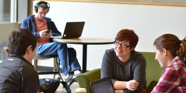 Students work together to study at a lounge on campus