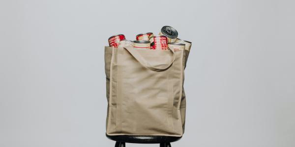 reusable grocery bag filled with canned food