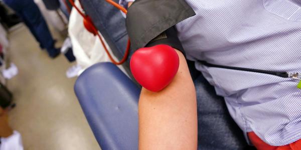 Person donating blood at a CU Boulder blood drive