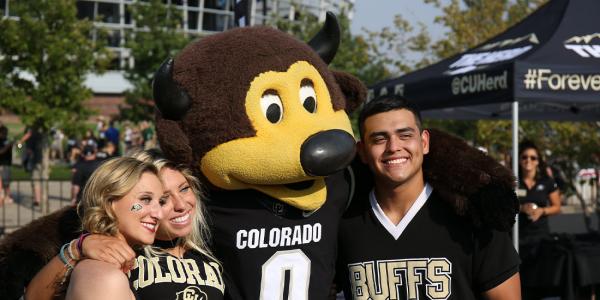 Buffs cheerleaders pose for a photo with Chip the buffalo mascot