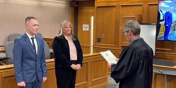 Matt Dillon and his mother Cathy Chestnut being sworn in as CUPD officers