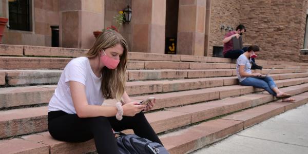 students on campus wearing masks