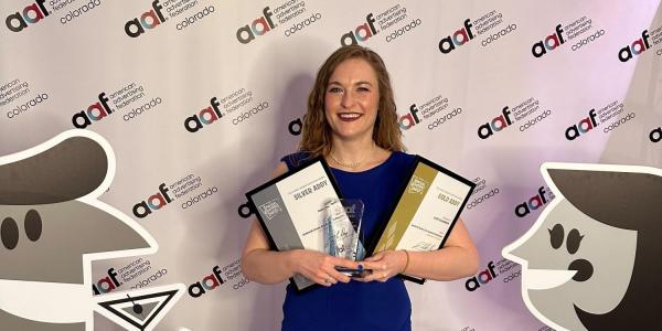 Kate Chambers poses with her prizes at the Addy awards