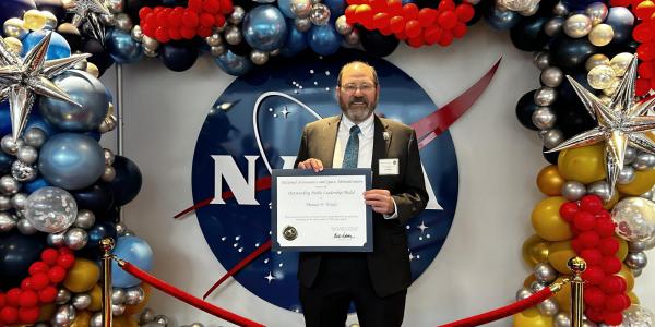 Tom Woods receiving NASA award