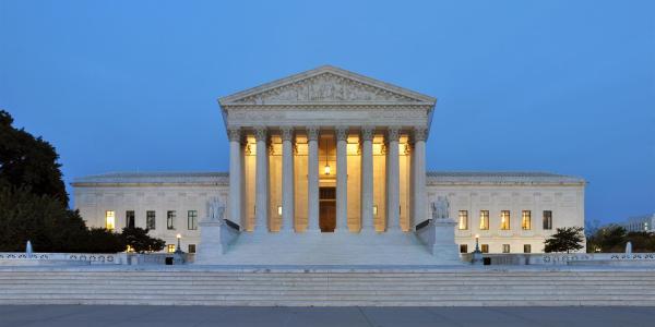 The United States Supreme Court building at dusk. 