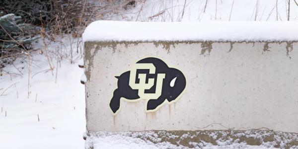 CU Buffs logo on a snow covered sign
