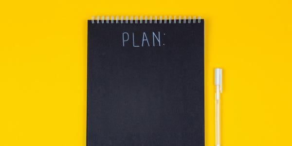 Small chalkboard image with the word "plan." (Unsplash/Volodymyr Hryshchenko)