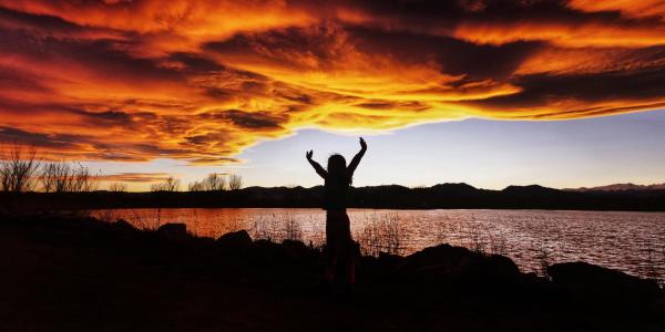 Silhouette of a person during a sunset at Waneka Lake in Lafayette, Colorado