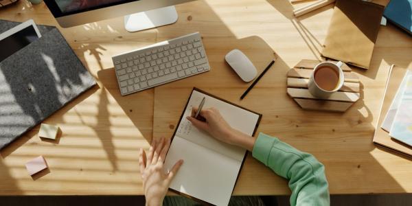 Person writing in a notebook