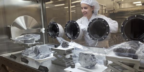 Geologist Carolyn Crow inspecting moon rocks at NASA's Johnson Space Center in Houston.