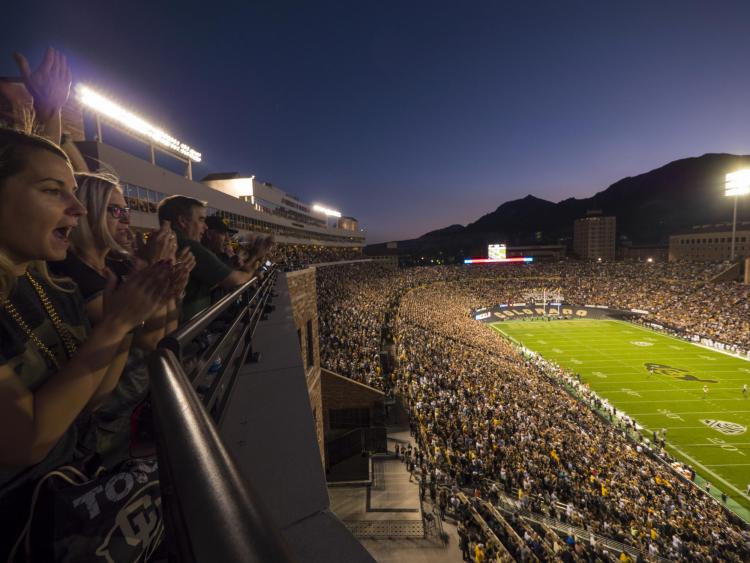 Night-time football game at Folsom Field