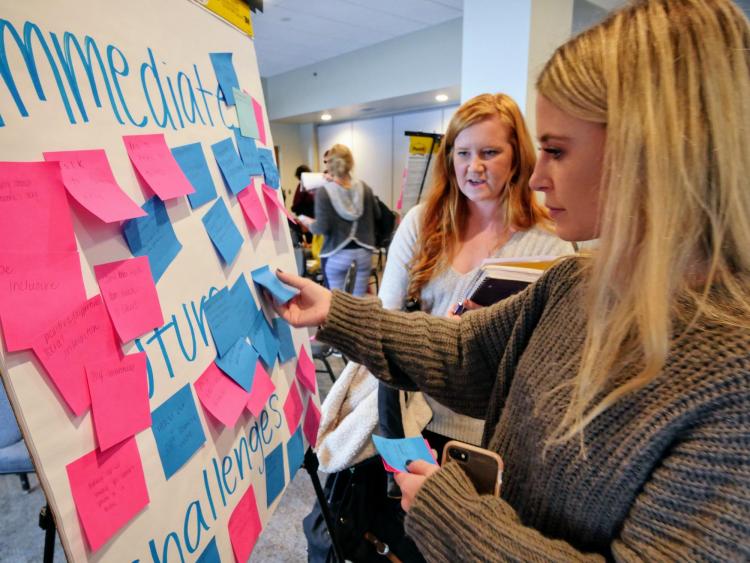 Participants map out challenges with sticky notes at the fall 2017 summit