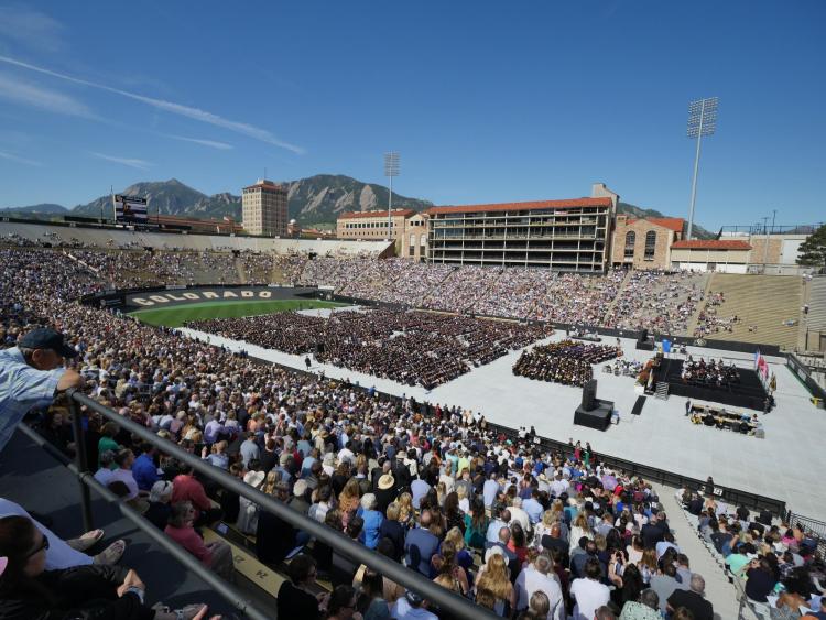 Scenic photo of Folsom Field during 2018 commencement ceremony. Photo by Glenn Asakawa.