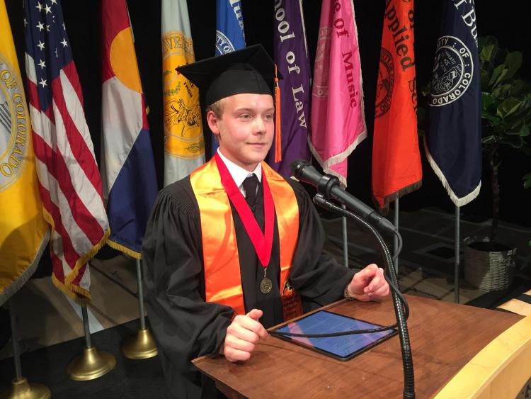 Chad Brokaw delivers his remarks from behind a podium