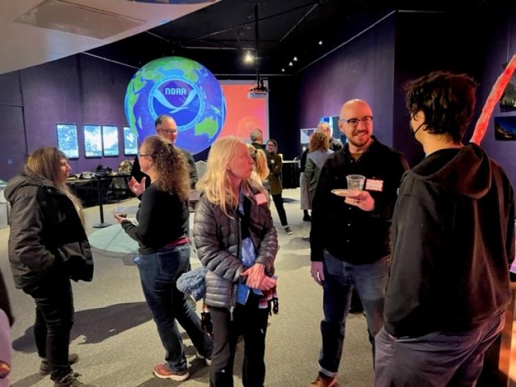 faculty members gather in Fiske Planetarium