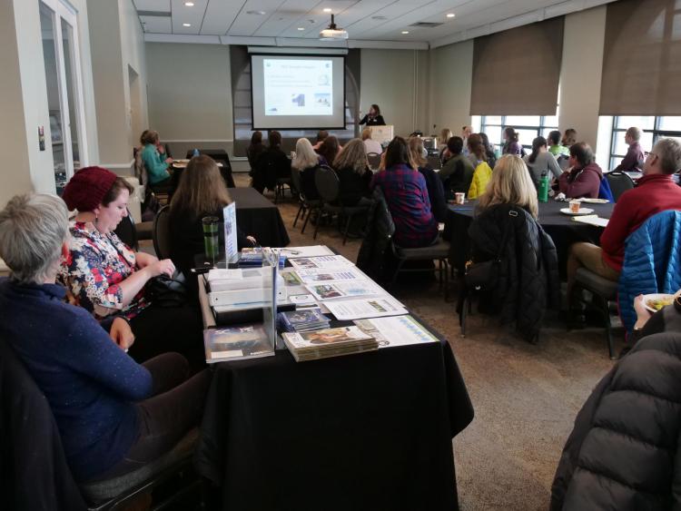 Faculty listen to presenter at a RIO workshop