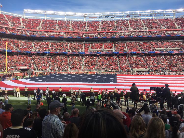 American flag on football field