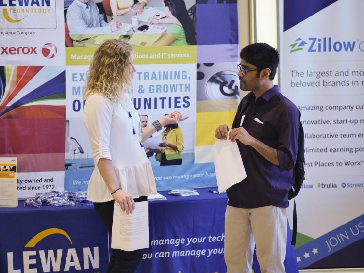 Student speaks with employer at a career fair